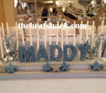 Rent personalized two-tiered Sweet 16 candle holder from the Brat Shack